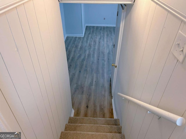 stairs with wood finished floors