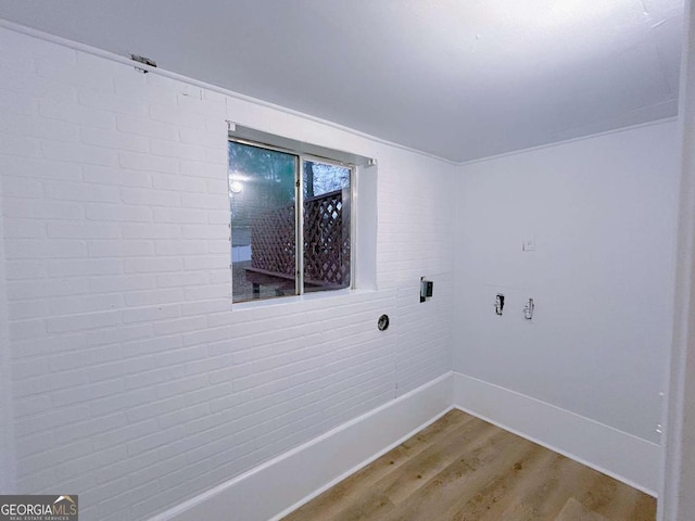 washroom with light wood-style flooring and baseboards