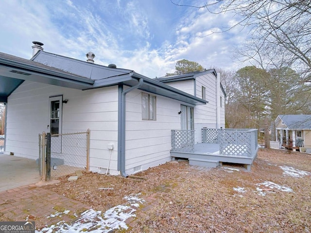 view of home's exterior featuring a deck