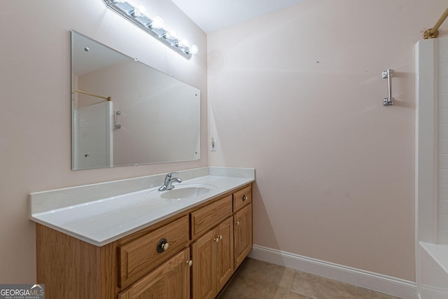 bathroom with vanity and baseboards