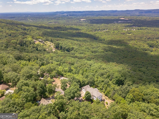 aerial view featuring a view of trees