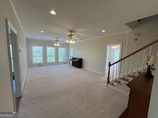 living area with recessed lighting, light colored carpet, a ceiling fan, stairs, and crown molding