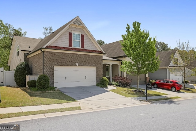 123 Heritage Pointe, Woodstock, GA 30189 - traditional-style home featuring brick siding, driveway, roof with shingles, and a standing seam roof