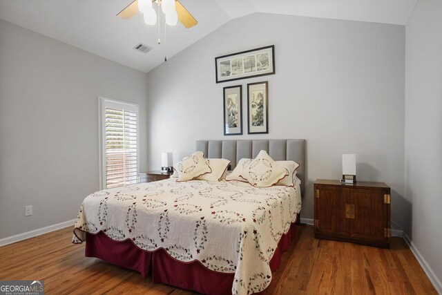 123 Heritage Pointe, Woodstock, GA 30189 - bedroom featuring wood finished floors, vaulted ceiling, baseboards, and ceiling fan