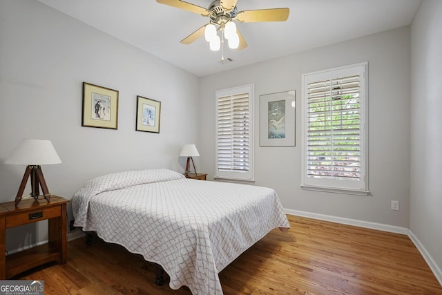 123 Heritage Pointe, Woodstock, GA 30189 - bedroom with wood finished floors, baseboards, and a ceiling fan