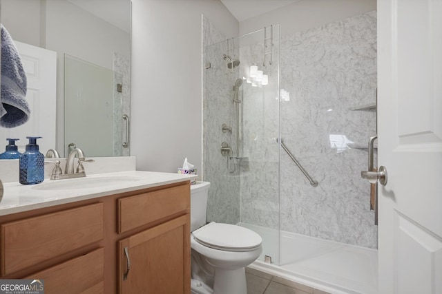 123 Heritage Pointe, Woodstock, GA 30189 - bathroom featuring toilet, vanity, a walk in shower, and tile patterned flooring