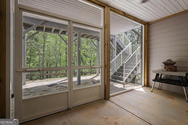 123 Heritage Pointe, Woodstock, GA 30189 - doorway to outside featuring wooden walls