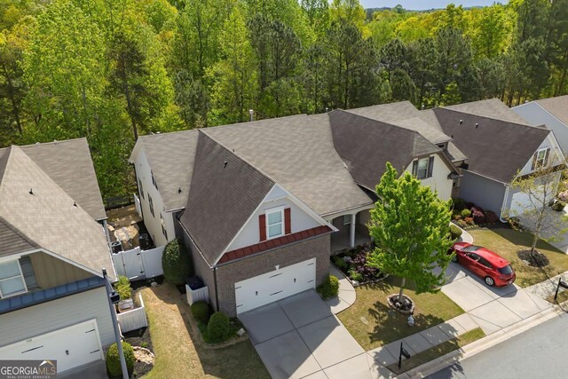 123 Heritage Pointe, Woodstock, GA 30189 - aerial view of property and surrounding area featuring a heavily wooded area