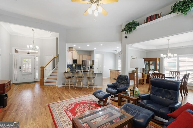 123 Heritage Pointe, Woodstock, GA 30189 - living room with a chandelier, a ceiling fan, light wood-style floors, and recessed lighting