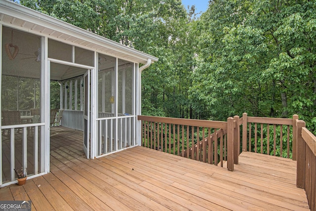 wooden terrace featuring a sunroom