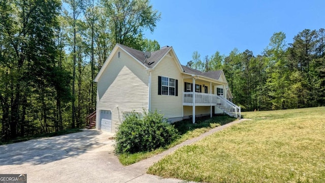 366 Blue Springs Way, Dallas, GA 30157 - view of side of property featuring driveway, covered porch, a garage, stairway, and a yard