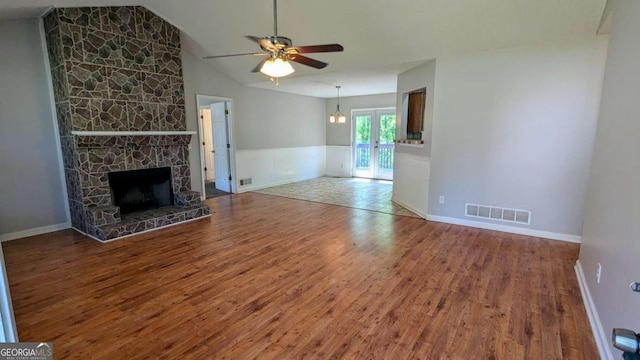 366 Blue Springs Way, Dallas, GA 30157 - unfurnished living room featuring a ceiling fan, wood finished floors, wainscoting, a fireplace, and visible vents
