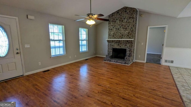 366 Blue Springs Way, Dallas, GA 30157 - unfurnished living room featuring vaulted ceiling, a ceiling fan, wood finished floors, and visible vents