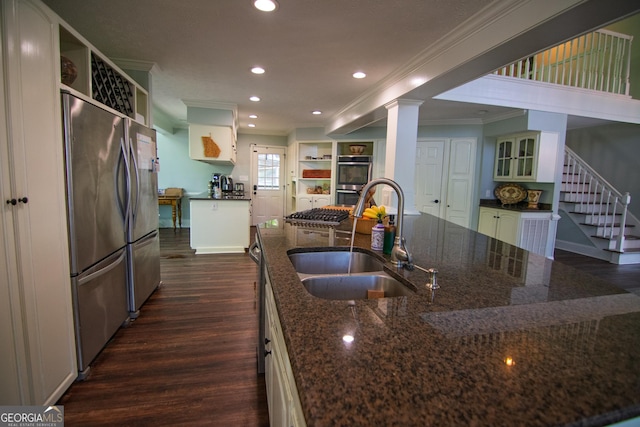 kitchen with crown molding, open shelves, a sink, stainless steel appliances, and dark wood-style flooring