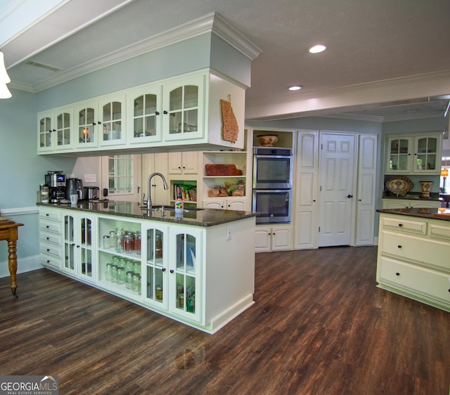 kitchen with open shelves, a sink, double oven, dark wood-style flooring, and recessed lighting