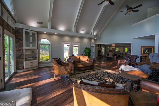 living area with dark wood-style floors, high vaulted ceiling, and ceiling fan