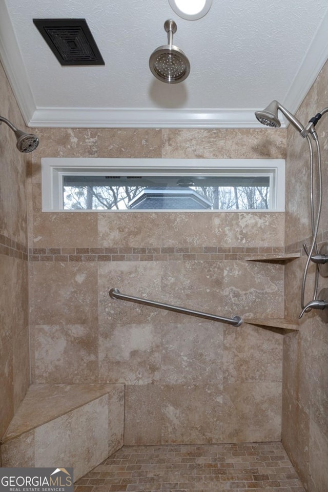 details with visible vents and tiled shower