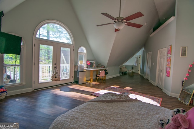 bedroom with wood finished floors, visible vents, baseboards, high vaulted ceiling, and access to outside