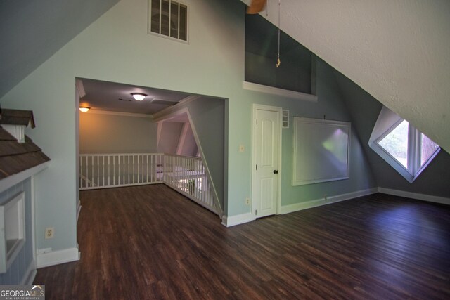 bonus room with vaulted ceiling, baseboards, wood finished floors, and visible vents