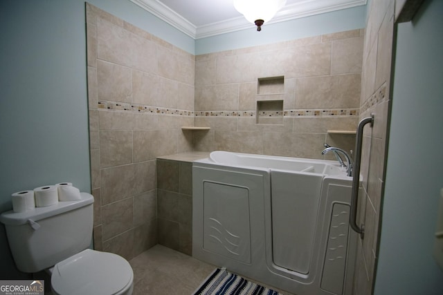 bathroom featuring a bath, toilet, and ornamental molding