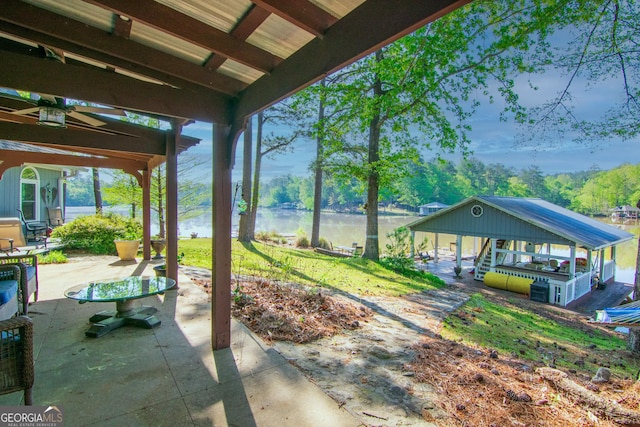 view of patio with a water view