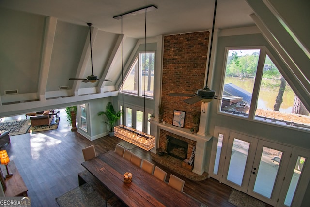 living area with visible vents, ceiling fan, and french doors