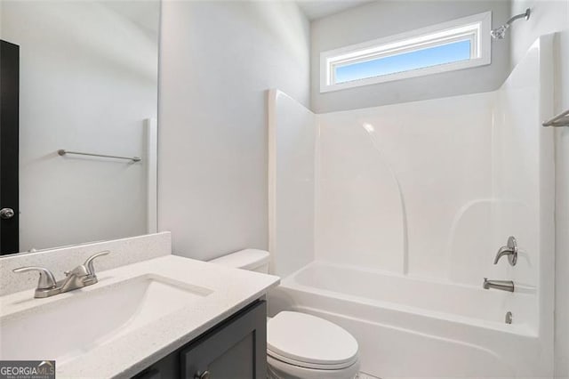 full bathroom with bathing tub / shower combination, vanity, and toilet