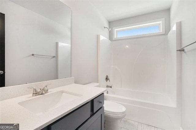 full bath with shower / bathing tub combination, toilet, and vanity