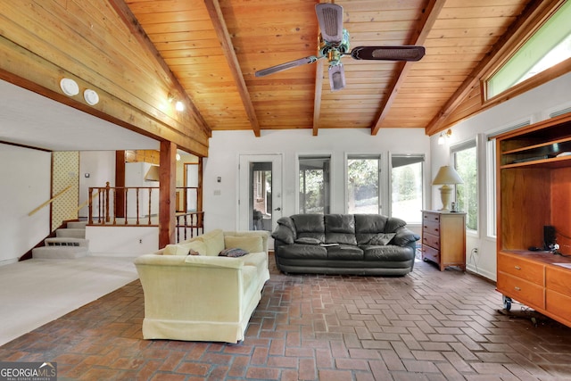 living room featuring ceiling fan, brick floors, stairs, and wooden ceiling