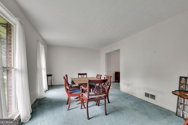 dining area featuring carpet flooring