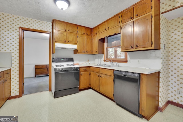 kitchen with black dishwasher, range with gas cooktop, under cabinet range hood, wallpapered walls, and a sink
