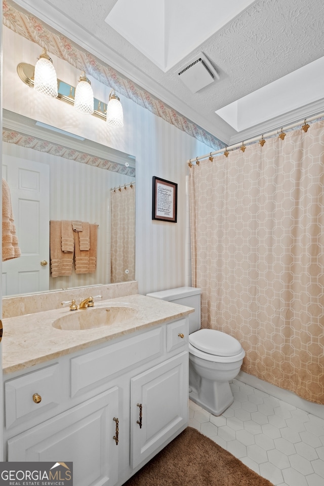 full bath featuring vanity, tile patterned floors, toilet, visible vents, and wallpapered walls