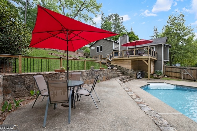 view of pool featuring a fenced in pool, a deck, a patio area, stairway, and a fenced backyard