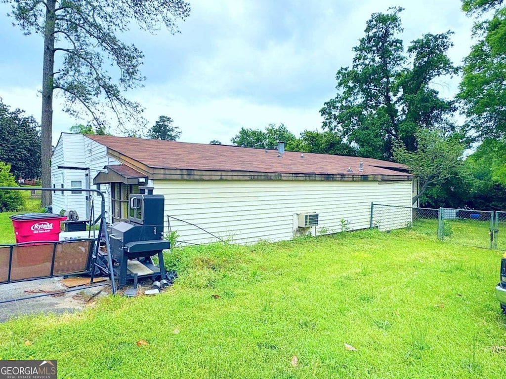 2831 Kent Dr, Macon, GA 31206 - view of side of home with fence and a lawn