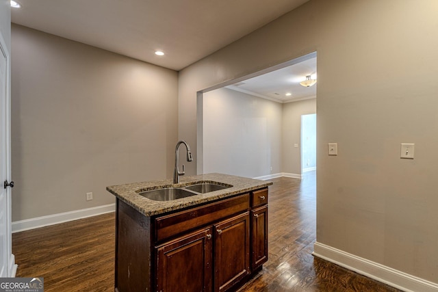 683 Pryor St SW Unit C, Atlanta, GA 30315 - kitchen featuring dark wood finished floors, baseboards, light stone countertops, and a sink