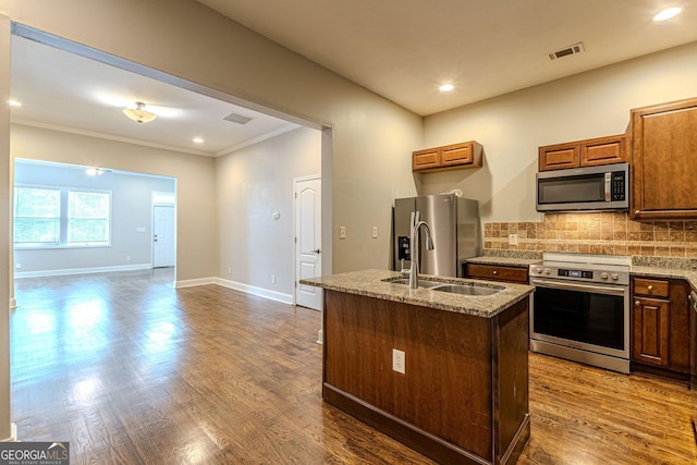 683 Pryor St SW Unit C, Atlanta, GA 30315 - kitchen featuring visible vents, ornamental molding, a sink, decorative backsplash, and appliances with stainless steel finishes