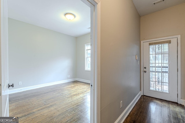 683 Pryor St SW Unit C, Atlanta, GA 30315 - doorway with wood finished floors, visible vents, and baseboards