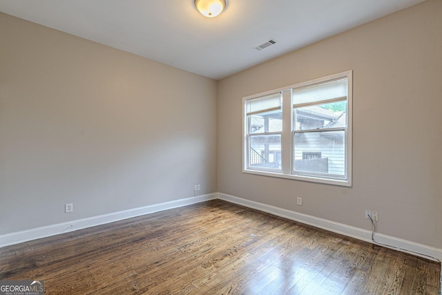 683 Pryor St SW Unit C, Atlanta, GA 30315 - unfurnished room with wood finished floors, visible vents, and baseboards