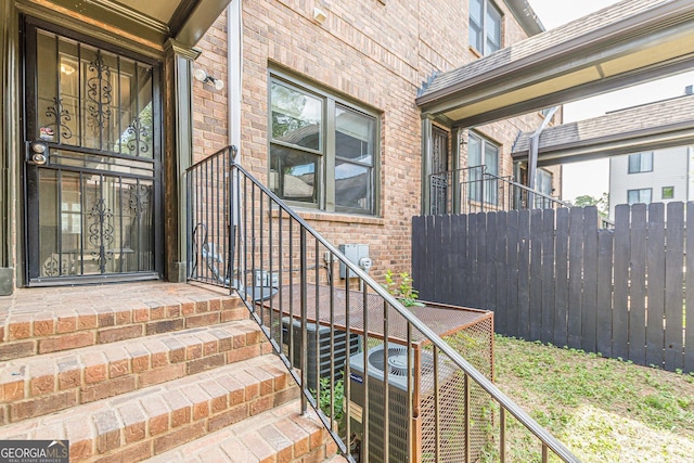 683 Pryor St SW Unit C, Atlanta, GA 30315 - entrance to property with fence, brick siding, and central air condition unit