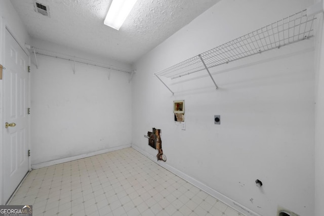 4512 Terret Trce NW, Acworth, GA 30101 - washroom featuring hookup for an electric dryer, light flooring, a textured ceiling, and washer hookup