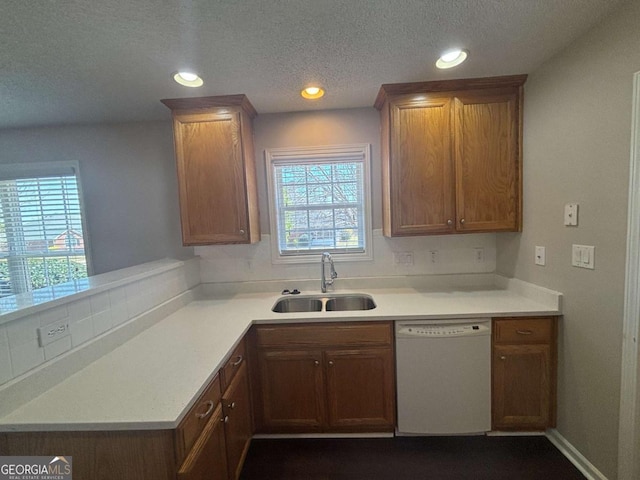 1365 Jubilee Ln, Mcdonough, GA 30253 - kitchen featuring a sink, recessed lighting, white dishwasher, brown cabinets, and light countertops