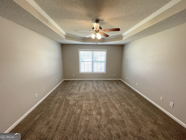 1365 Jubilee Ln, Mcdonough, GA 30253 - spare room with ceiling fan, a textured ceiling, and a raised ceiling