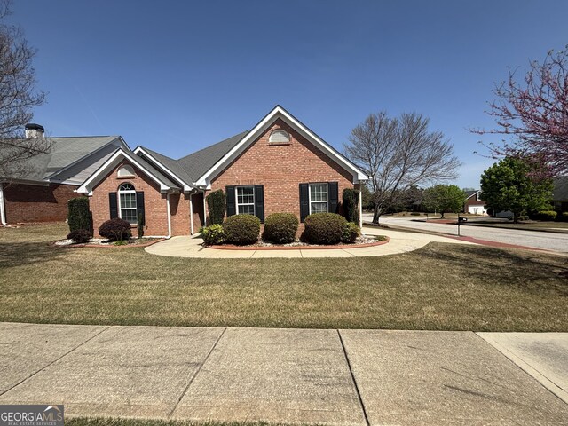 1365 Jubilee Ln, Mcdonough, GA 30253 - view of front facade with brick siding and a front yard