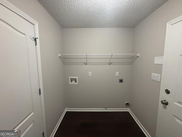 1365 Jubilee Ln, Mcdonough, GA 30253 - washroom featuring a textured ceiling, hookup for an electric dryer, baseboards, laundry area, and washer hookup