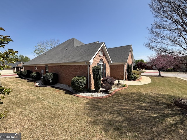 1365 Jubilee Ln, Mcdonough, GA 30253 - view of side of property featuring brick siding, a yard, and roof with shingles