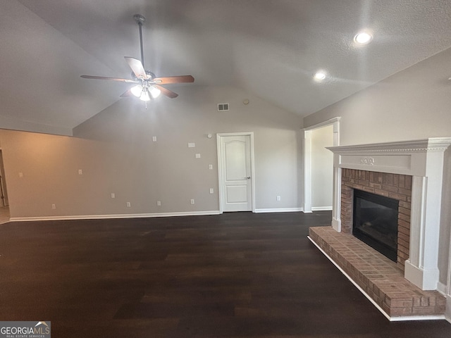 1365 Jubilee Ln, Mcdonough, GA 30253 - unfurnished living room featuring vaulted ceiling, wood finished floors, a ceiling fan, baseboards, and a brick fireplace