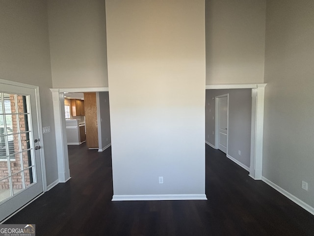 1365 Jubilee Ln, Mcdonough, GA 30253 - interior space featuring baseboards, a towering ceiling, and dark wood finished floors