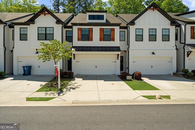 townhome / multi-family property with brick siding, an attached garage, and concrete driveway
