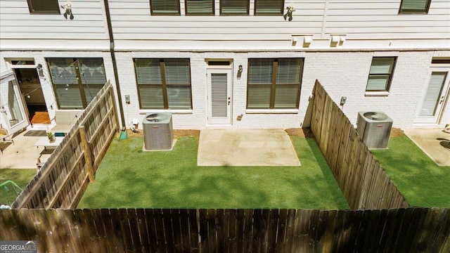 back of property featuring a patio area, a fenced backyard, and cooling unit