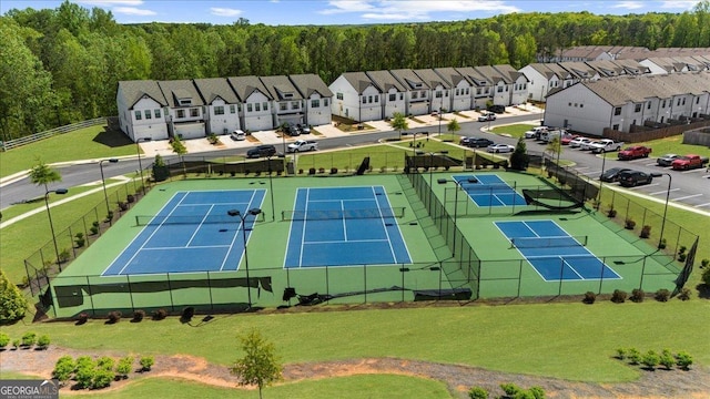aerial view featuring a residential view and a wooded view